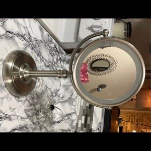 Lighted mirror with magnification